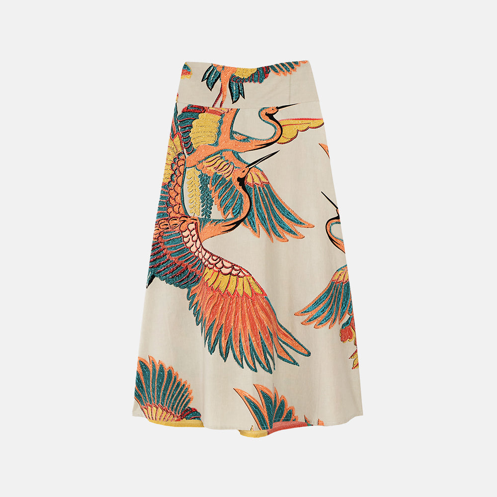 a-line skirt with design of cranes in orange, green & blue on a stone base