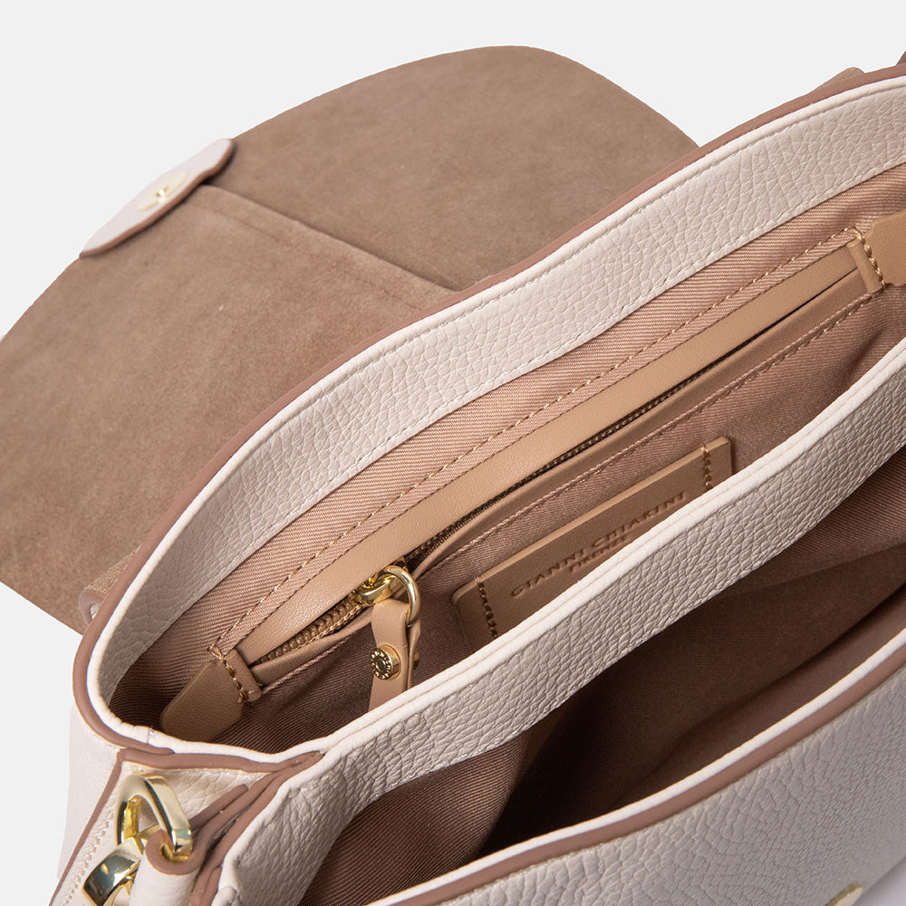 off white leather saddle shape handbag with brown canvas lining