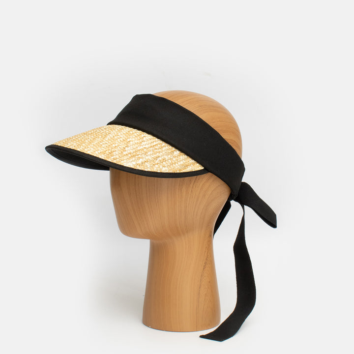 natural straw visor with black band and ribbon tie at back