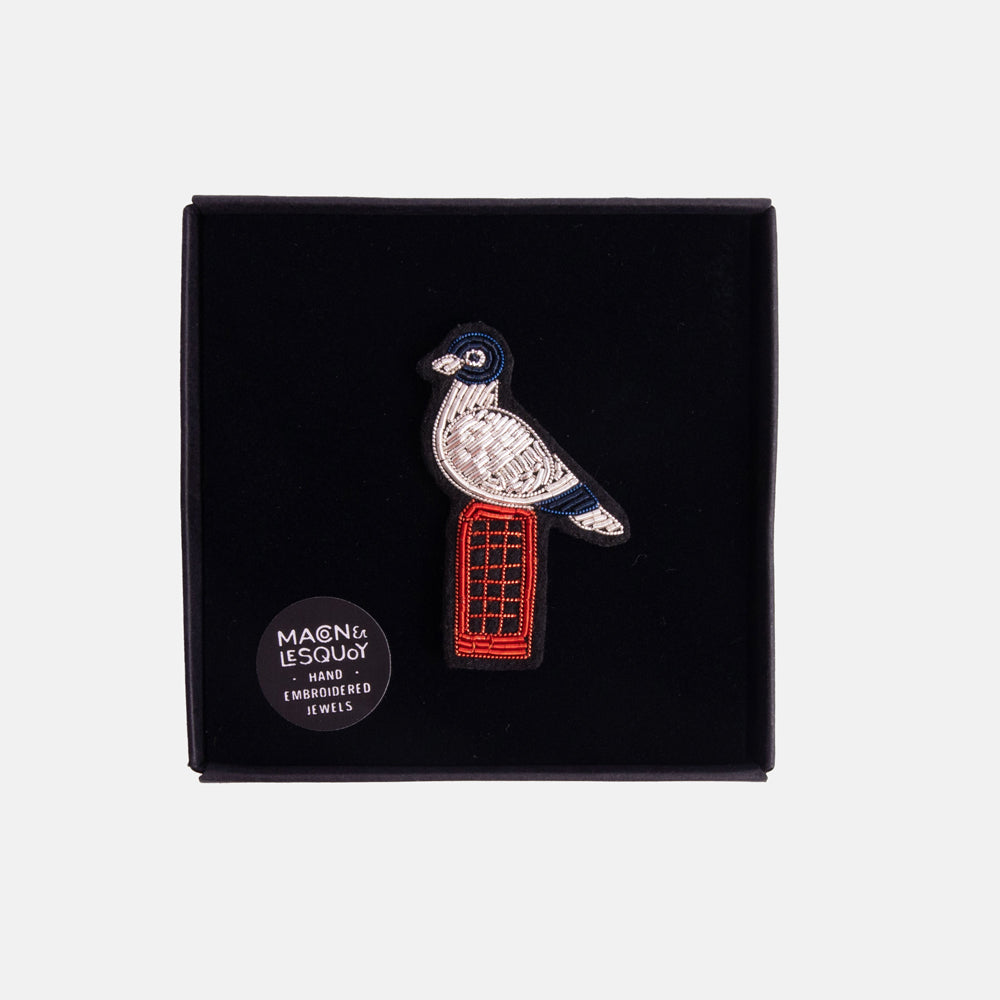 bird perched on a red phone box beaded brooch in a velvet presentation box