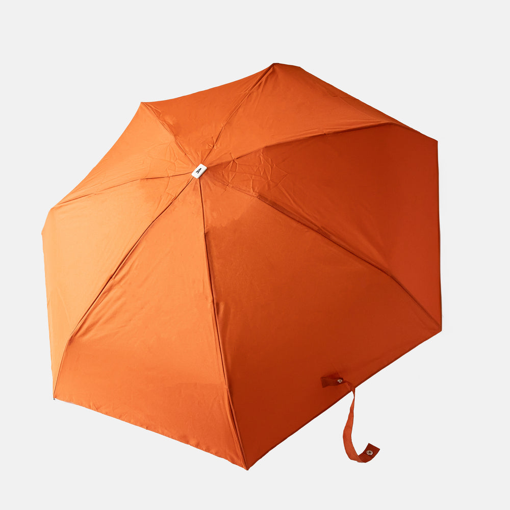 rust orange compact folding umbrella open
