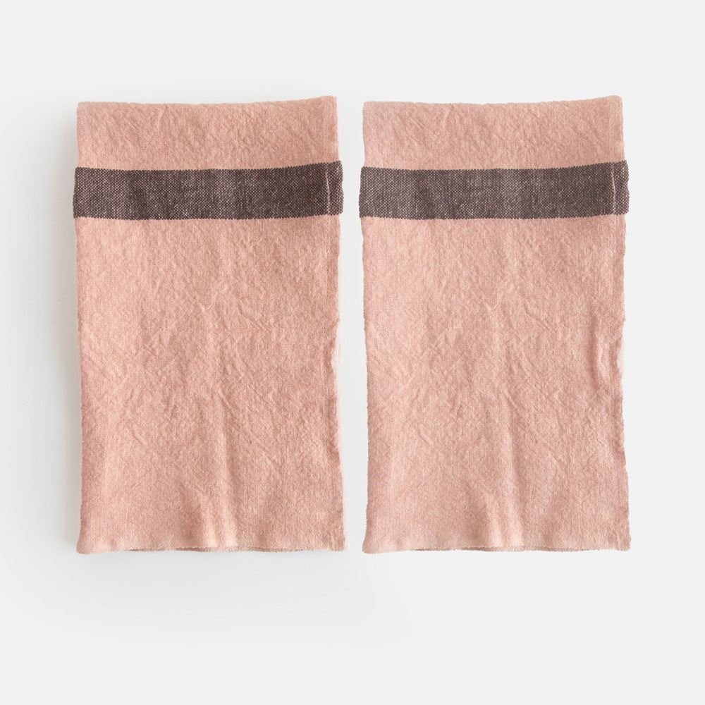 set of 2 light pink washed linen placemats with dark central stripe