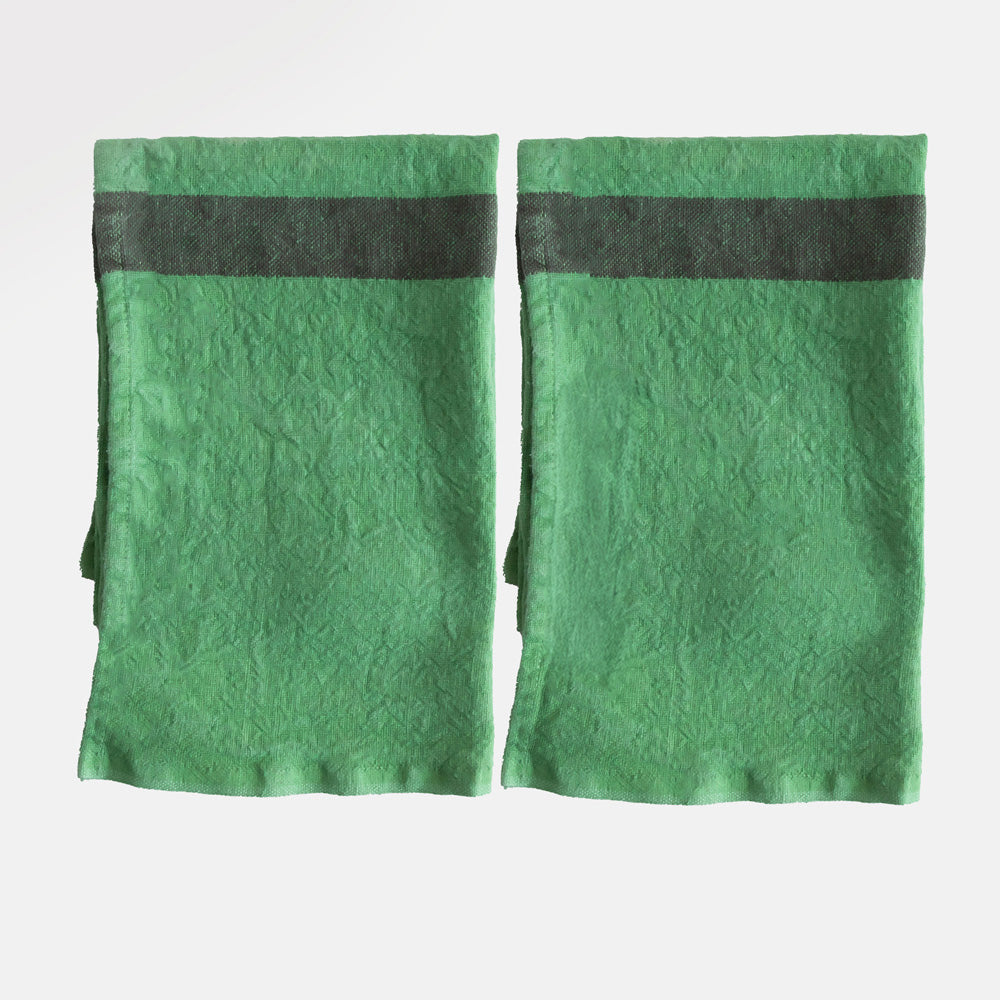set of 2 green washed linen placemats with dark central stripe