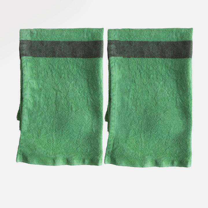 set of 2 green washed linen placemats with dark central stripe