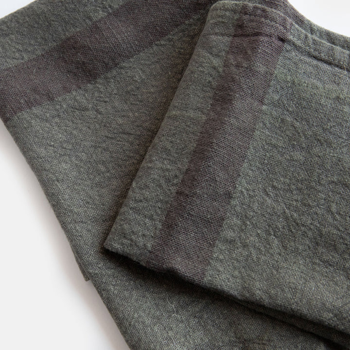 set of 2 graphite grey washed linen placemats with dark grey central stripe
