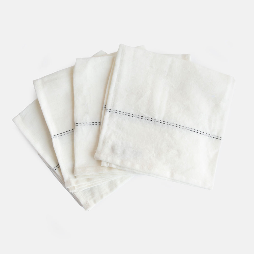 set of 4 white linen napkins with black stitch detailing 