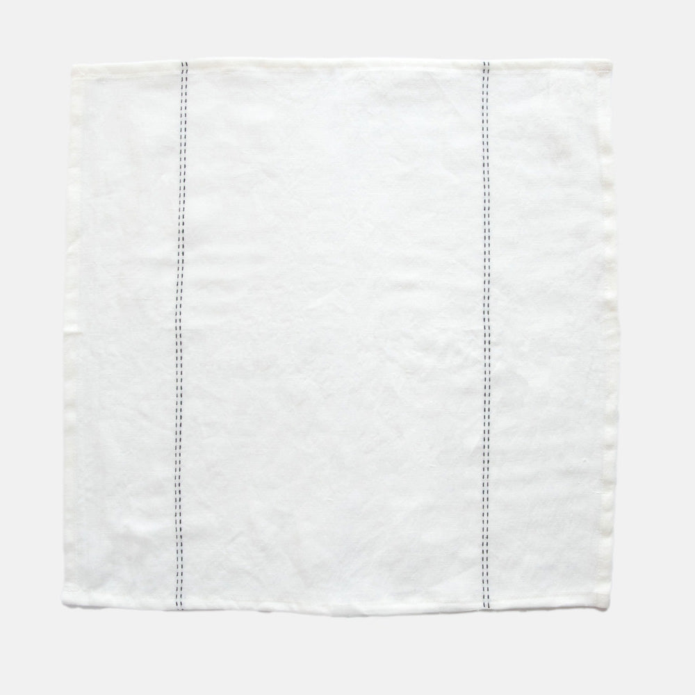set of 4 white linen napkins with black stitch detailing 