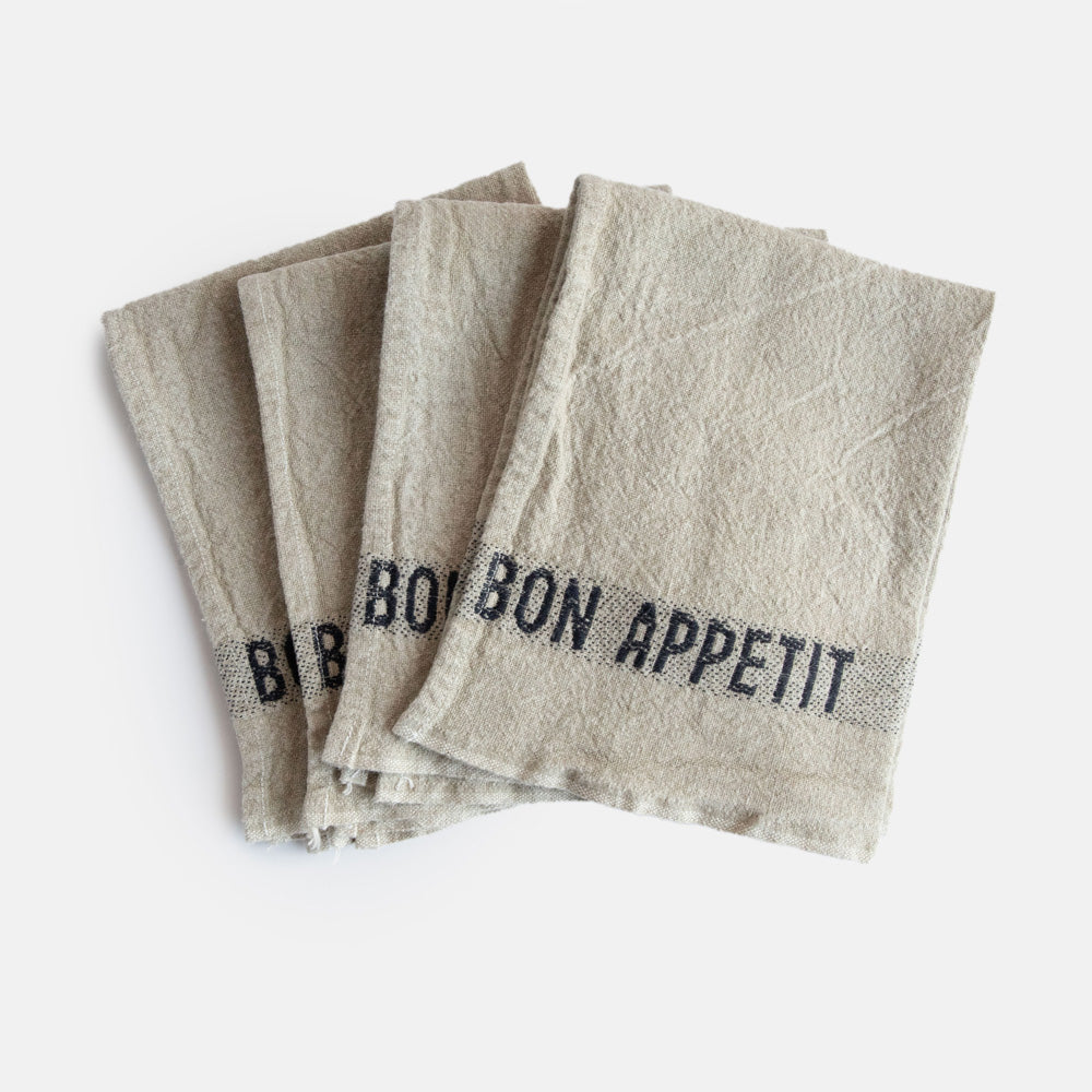 set of 4 pure linen napkins in natural colour with black bon appetit wording at either end