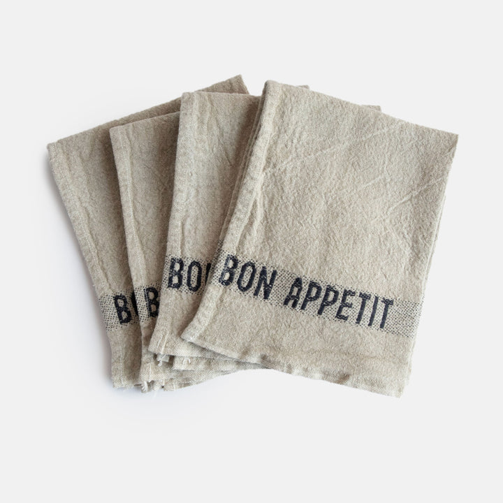 set of 4 pure linen napkins in natural colour with black bon appetit wording at either end