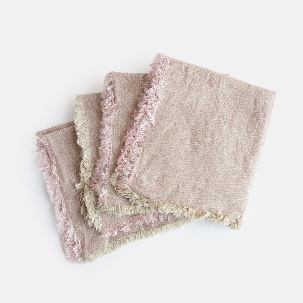 set of 4 light pink textured linen napkins with tasselled edges