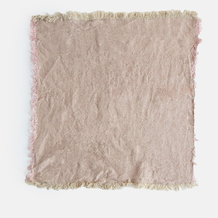 set of 4 light pink textured linen napkins with tasselled edges