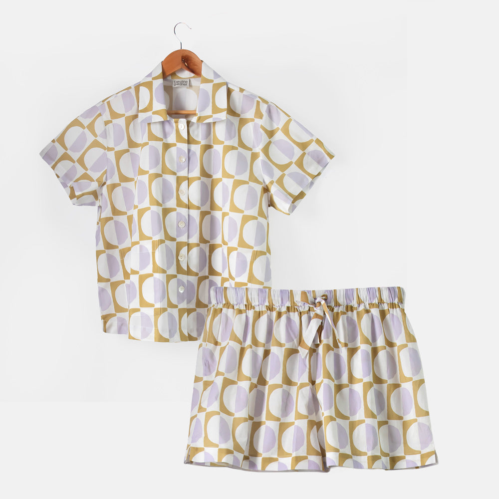 women's short pyjama set with button up shirt and shorts in lilac, green and white geometric circles design