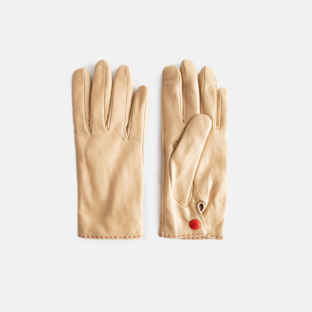 pair of women's leather gloves with popper closure at wrist, in cream colour
