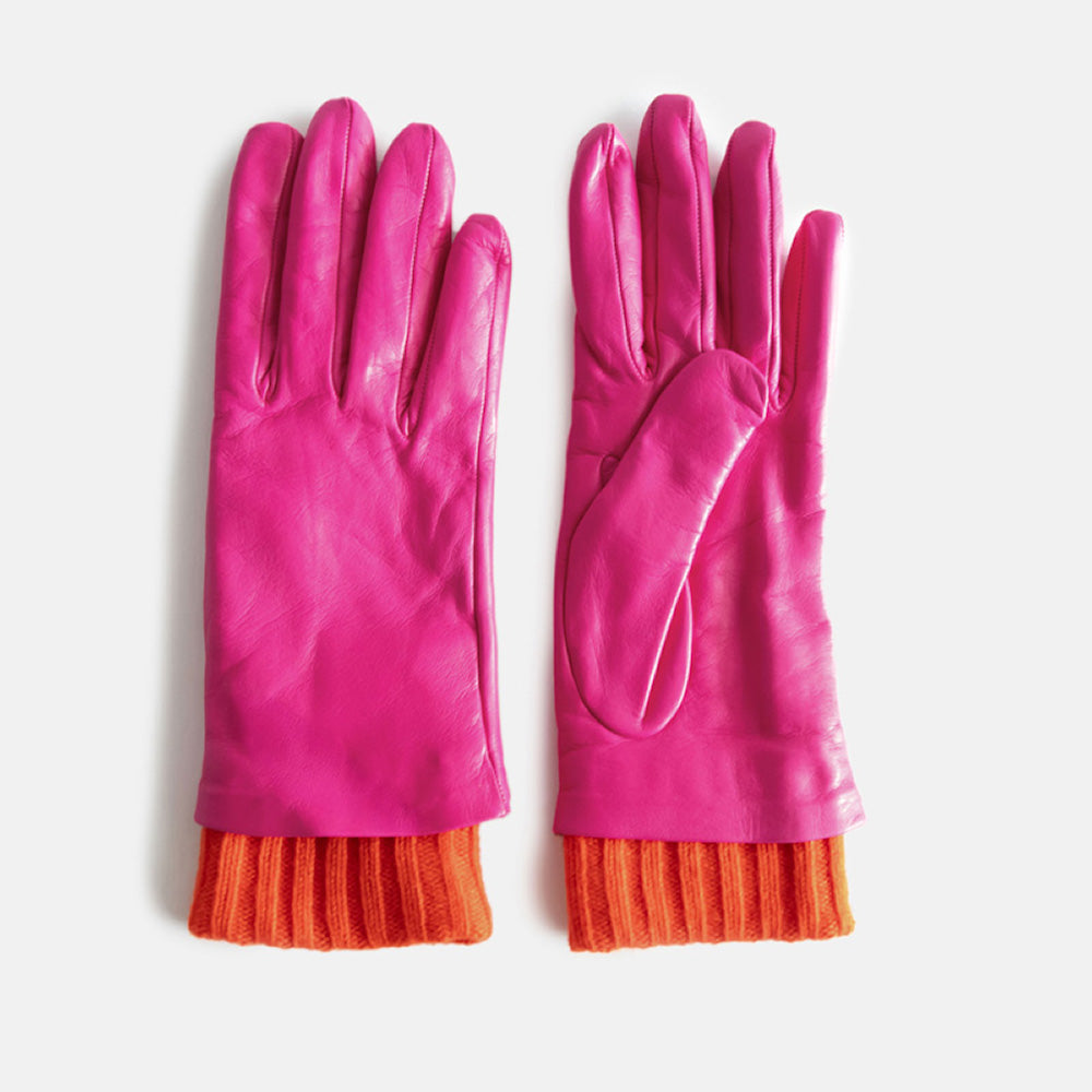 pair of women's leather gloves in bright pink with red ribbed wrist cuff