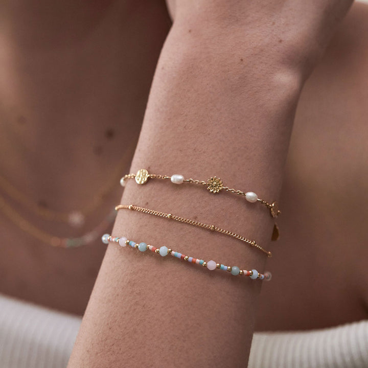 duo bracelet with one fine gold chain and one chain with Miyuki, natural quartz and glass beads. 