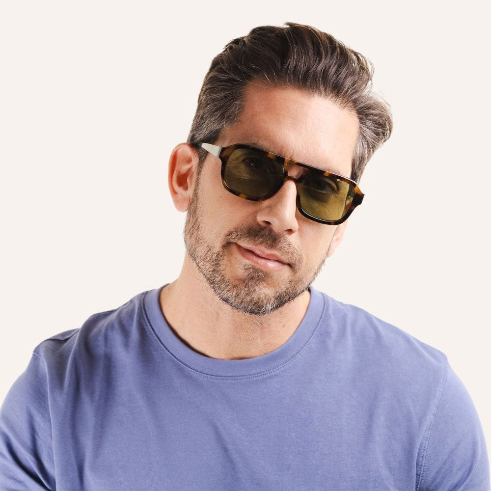man wearing brown tortoiseshell double bridge modern aviator style sunglasses with green lenses