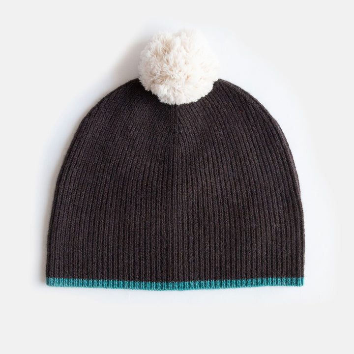women's dark brown fine rib beanie hat with teal trim and white pom pom
