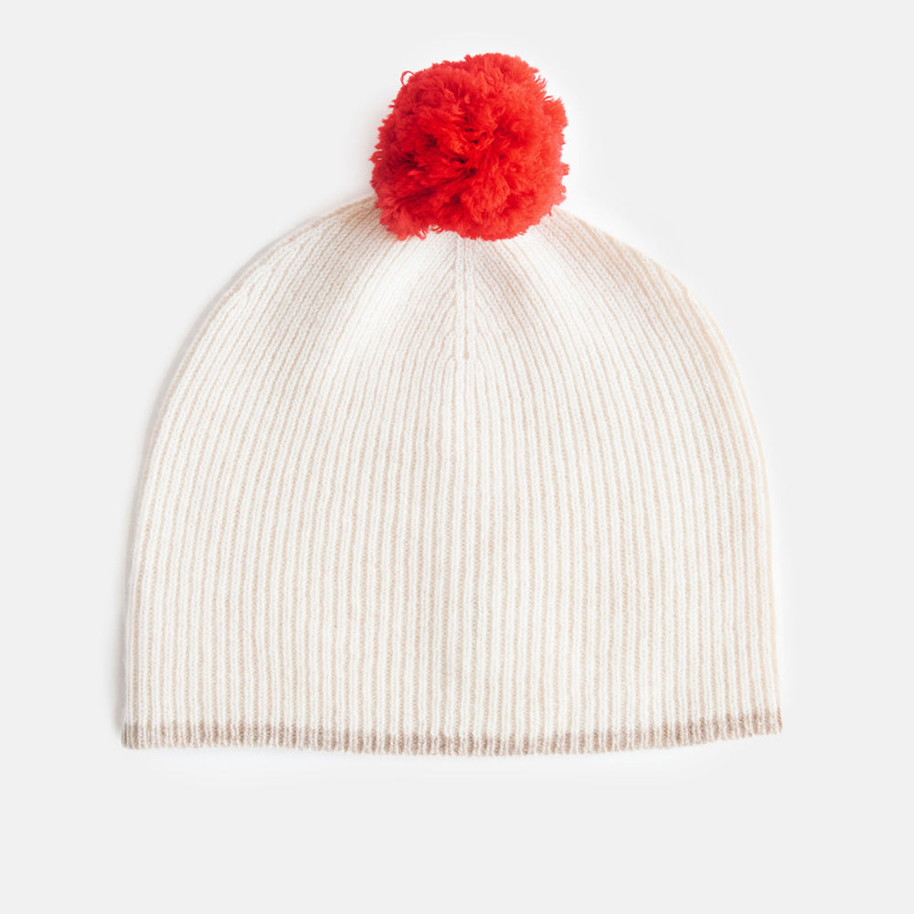 women's cream fine rib beanie hat with taupe trim and bright red pom pom