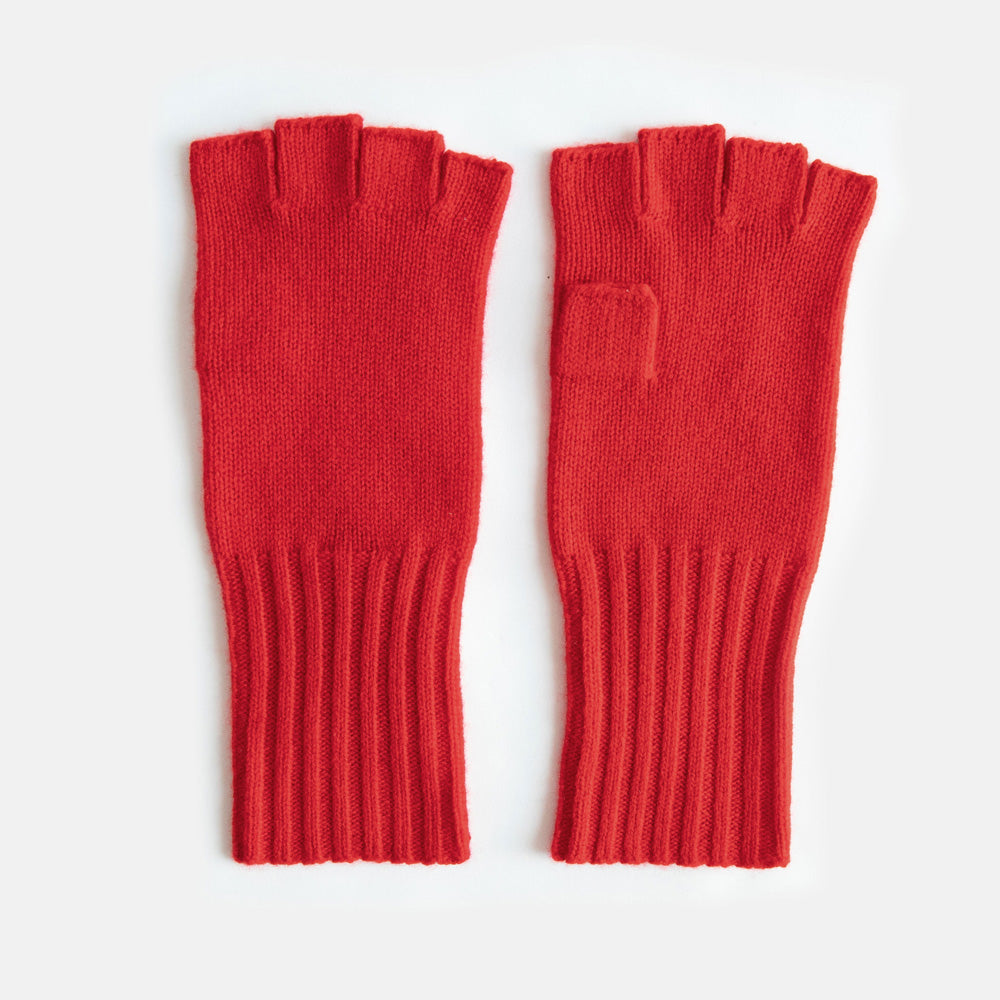 Pair of red fingerless gloves on a white background