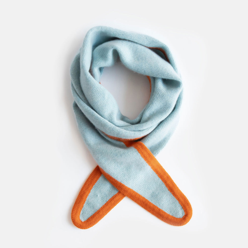 women's cashmere neck scarf in light blue with orange trim