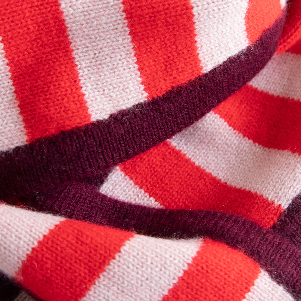women's cashmere neck scarf in red & pink stripe design with contrast burgundy trim. 