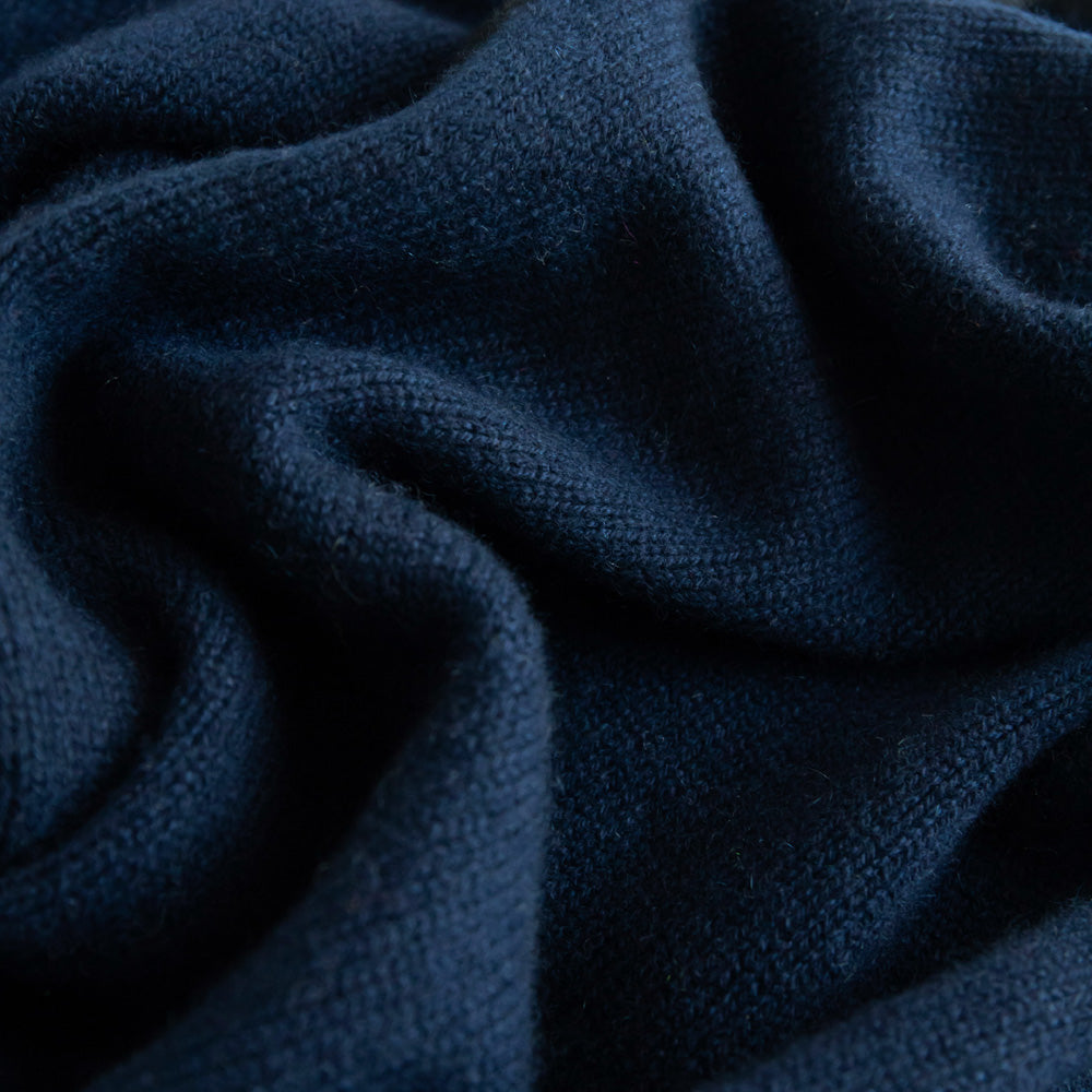 women's cashmere triangle scarf in navy blue with black trim