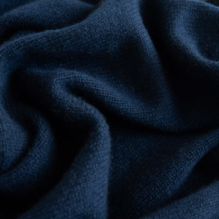 women's cashmere triangle scarf in navy blue with black trim