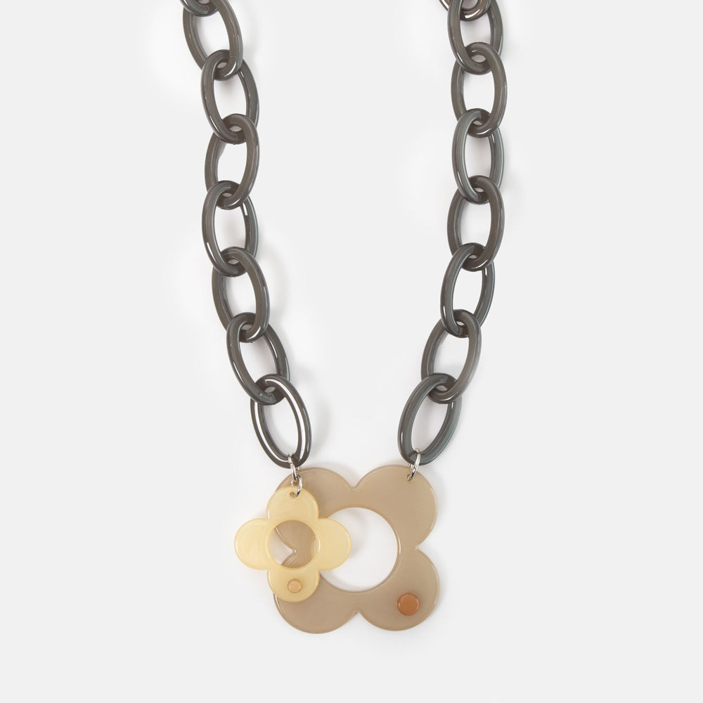 Necklace with floral pendant on a white background