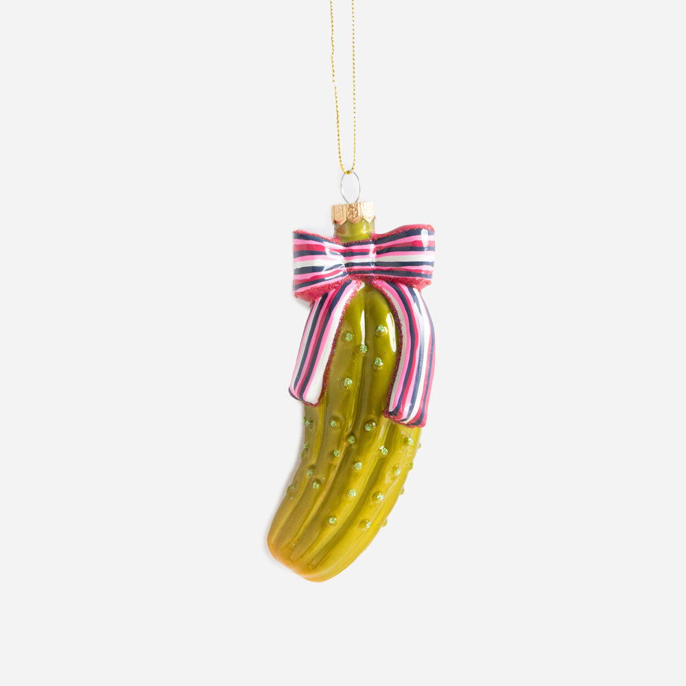 green gherkin or pickle with a colourful bow hanging christmas decoration
