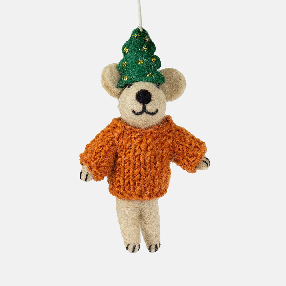 Bear hanging christmas tree decoration wearing an orange sweater and green tree hat on a white background