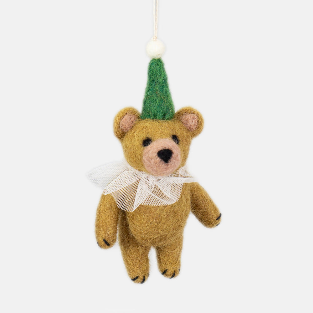 Teddy bear hanging christmas decoration with a green hat on a white background