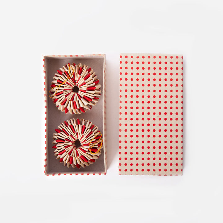 set of 2 red and white paper wheel Christmas decorations in a presentation box 