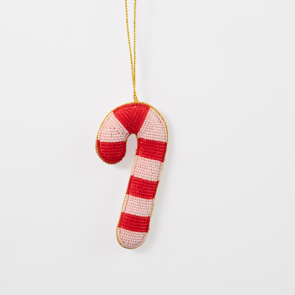 Candy cane christmas tree decoration with red and pink stripes on a gold chain against a light grey background