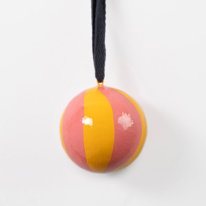 pink & yellow swirl stripe hanging christmas tree bauble with navy cotton hanging loop