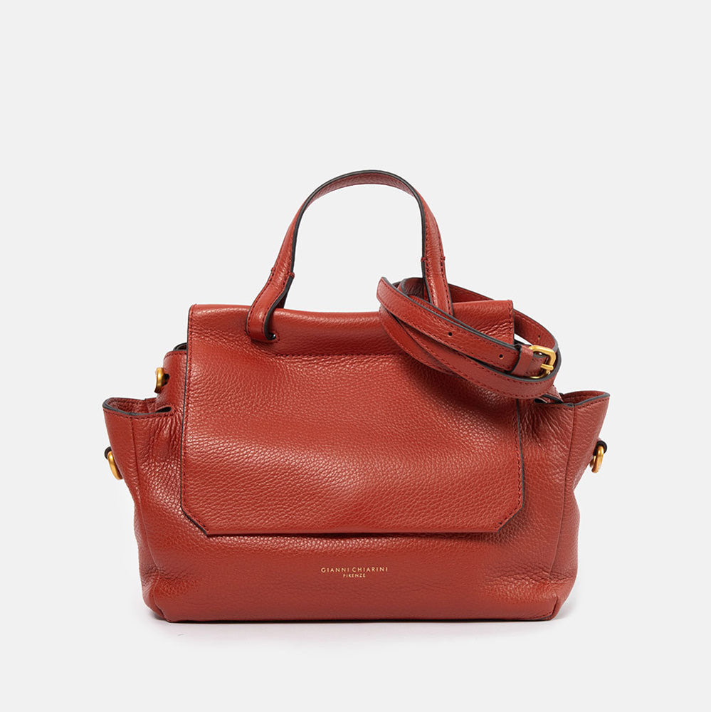 dark red pebbled leather handbag with top shoulder handle and matching leather crossbody strap