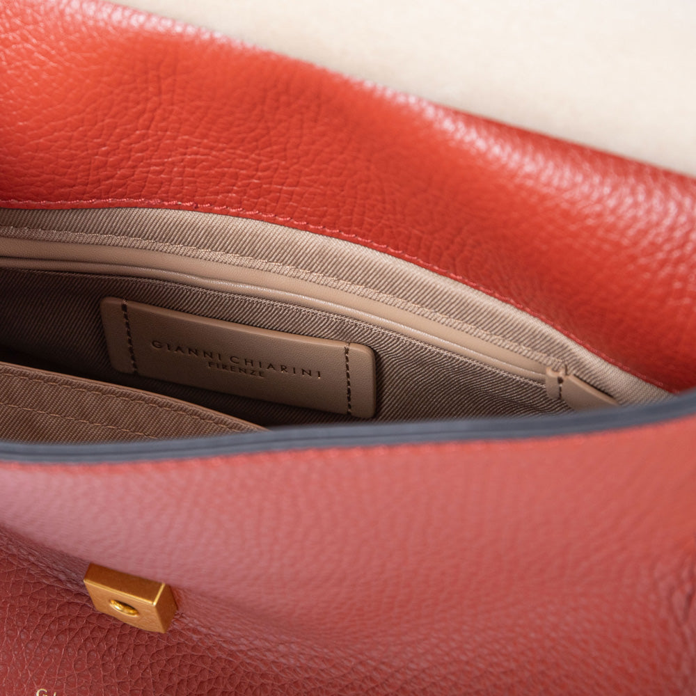 dark red pebbled leather handbag with canvas lined internal compartment