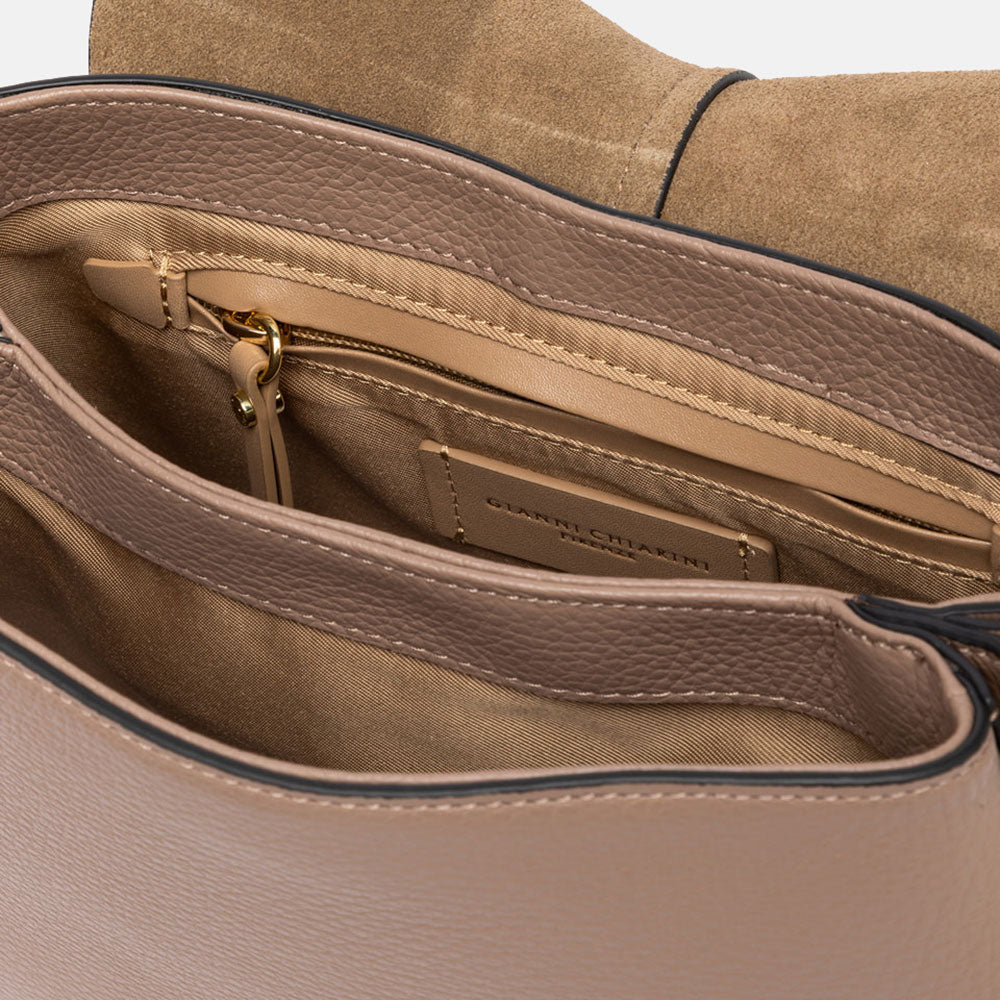 dove grey pebbled leather saddle handbag with canvas lined internal compartment