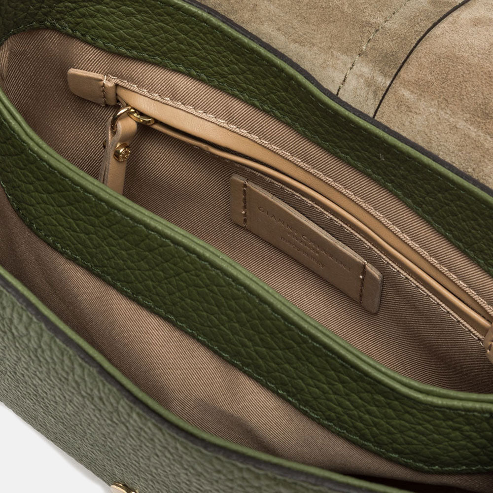 dark green pebbled leather baguette saddle bag with canvas lined internal compartment