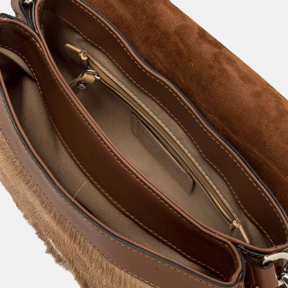 brown & cream springbok leather baguette shaped saddle bag with canvas lined internal compartment
