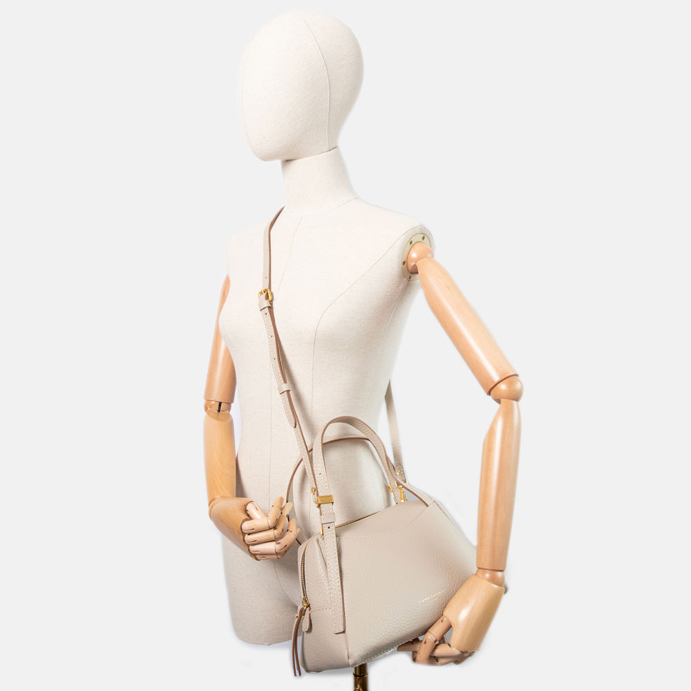light grey pebbled leather handbag with detachable crossbody strap and gold hardware