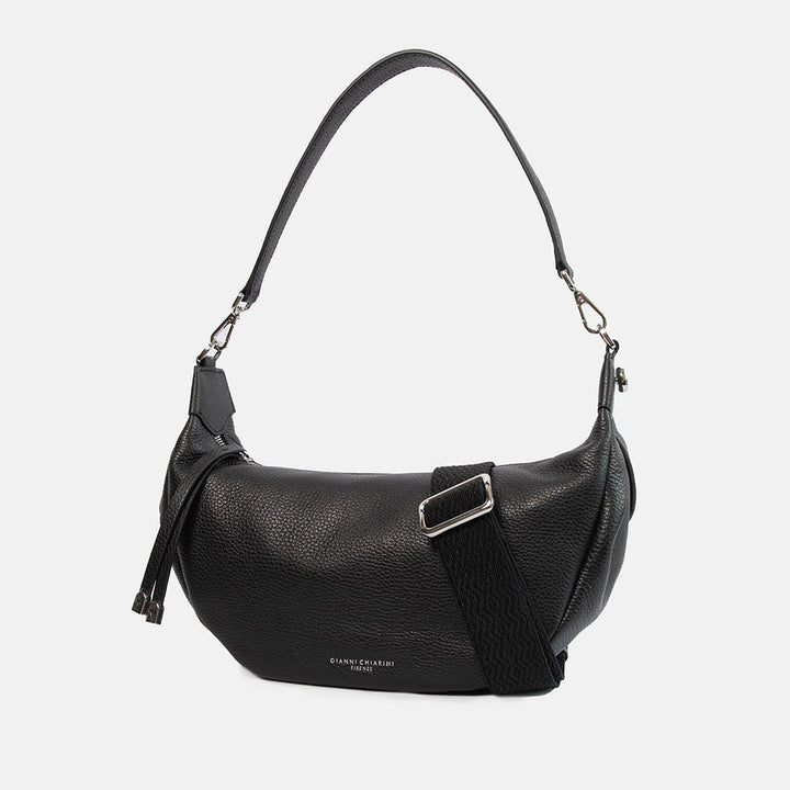 black pebbled leather sling bag with leather shoulder strap and webbing crossbody strap