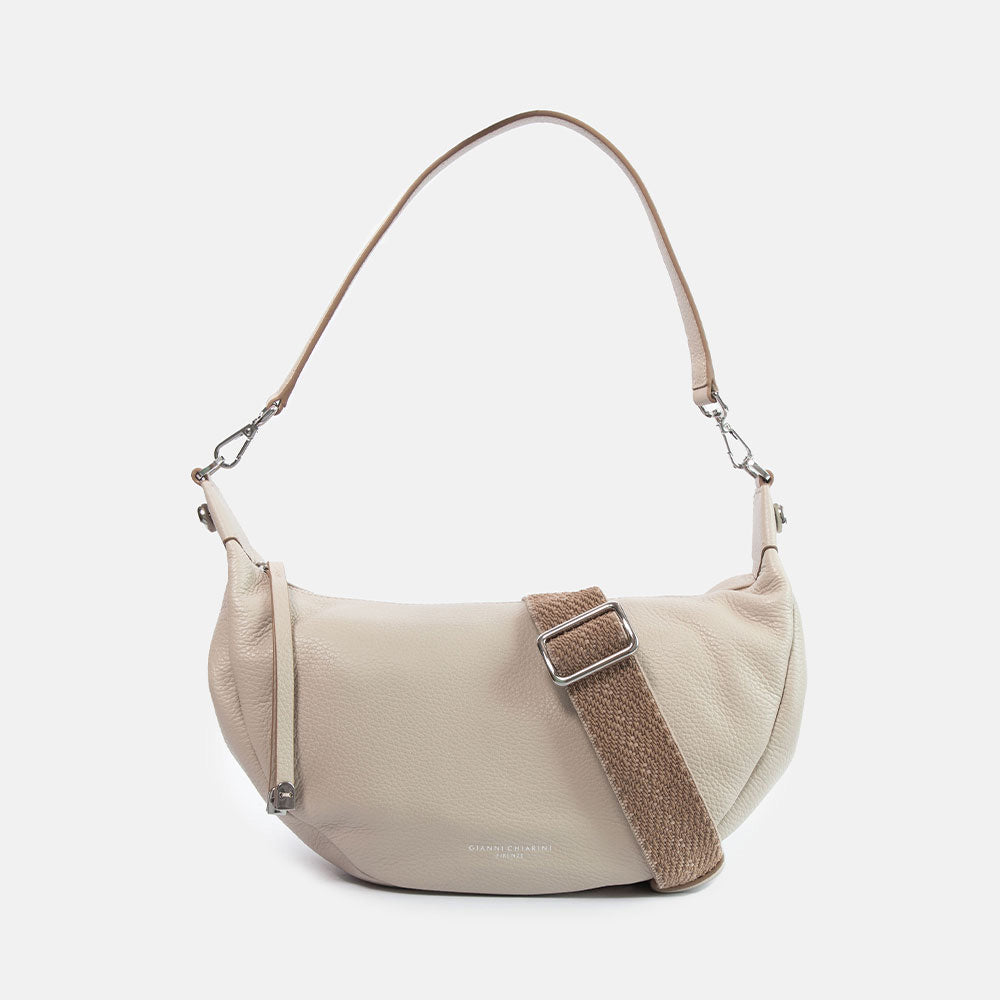 light grey pebbled leather sling bag with leather shoulder strap and webbing crossbody strap