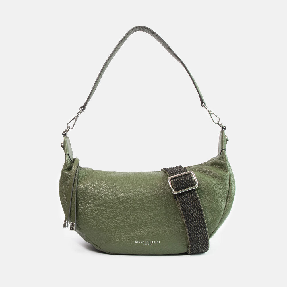 green pebbled leather sling bag with leather shoulder strap and webbing crossbody strap