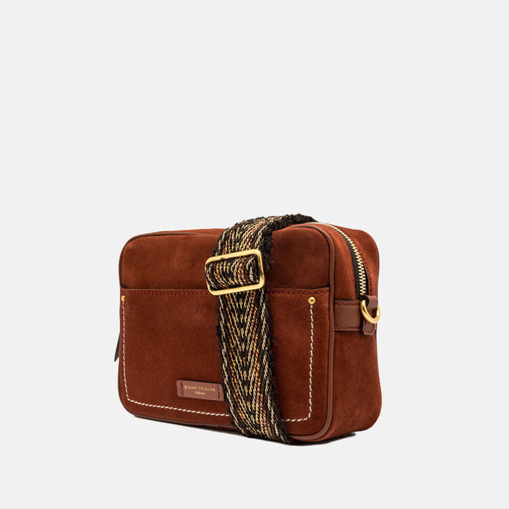 brick red suede leather handbag with woven fabric crossbody strap