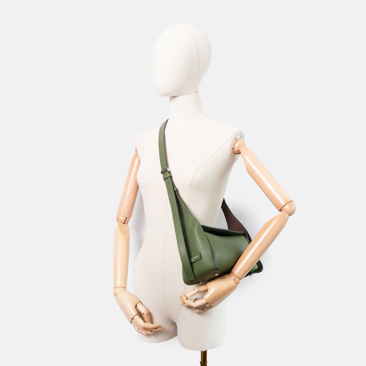 green pebbled leather bag with adjustable shoulder and crossbody strap