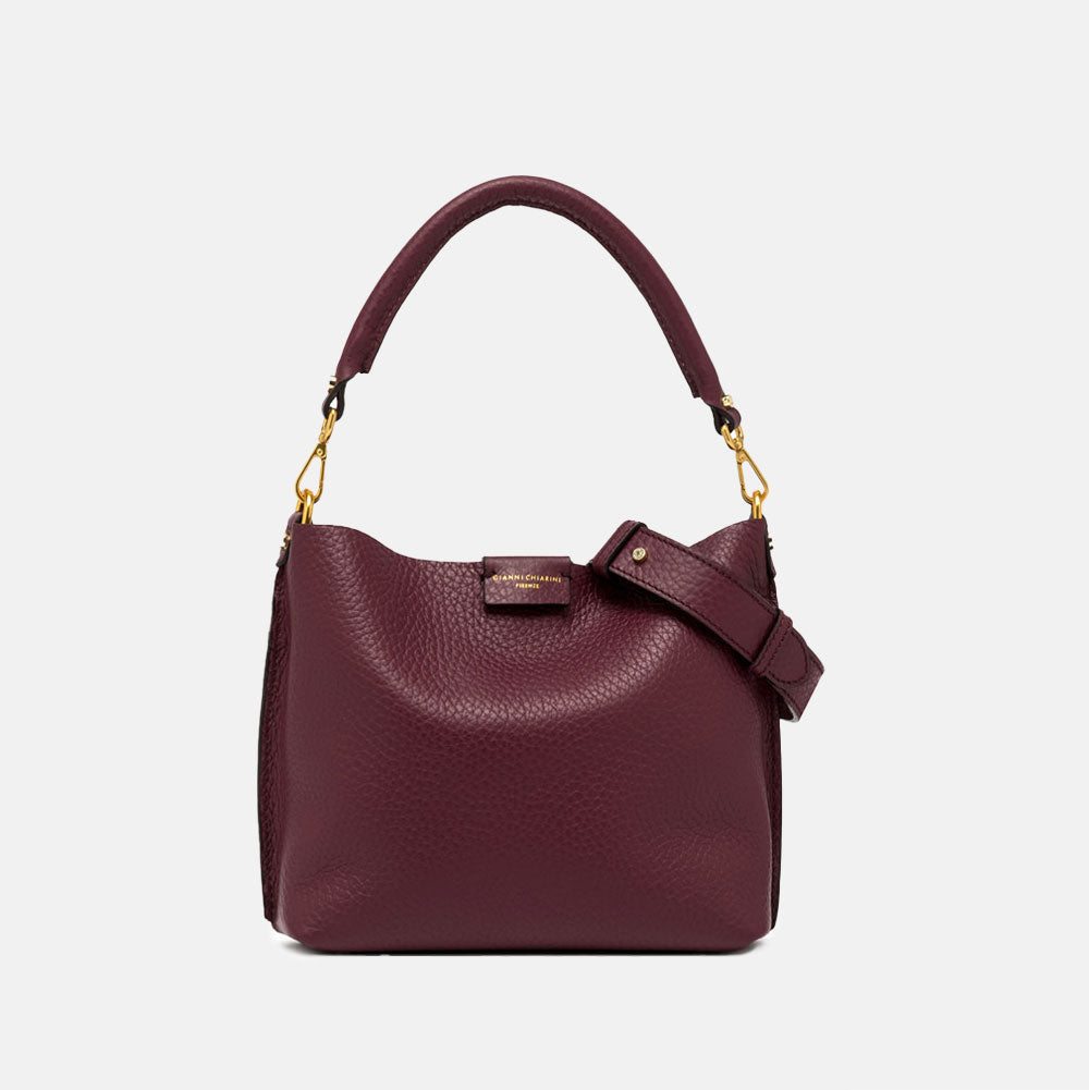 burgundy pebbled leather handbag with grab handle and gold hardware
