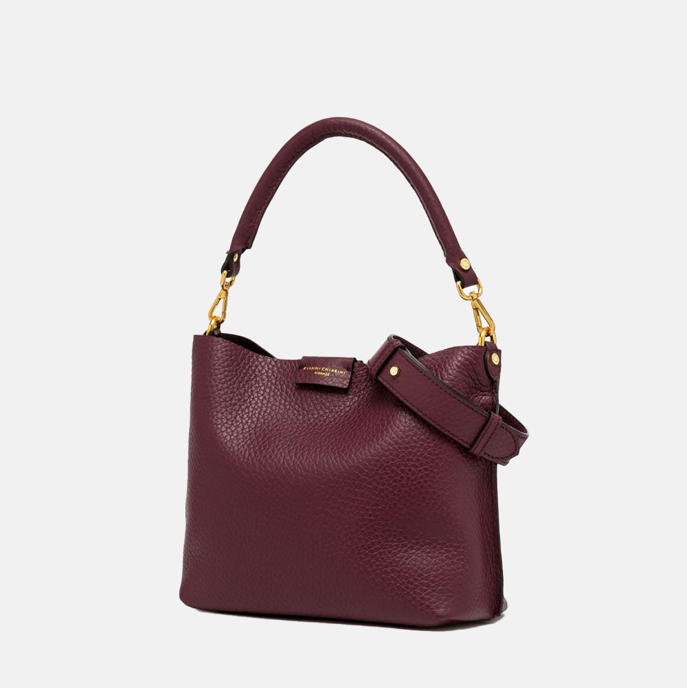 burgundy pebbled leather handbag with grab handle and gold hardware