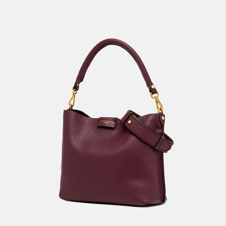 burgundy pebbled leather handbag with grab handle and gold hardware