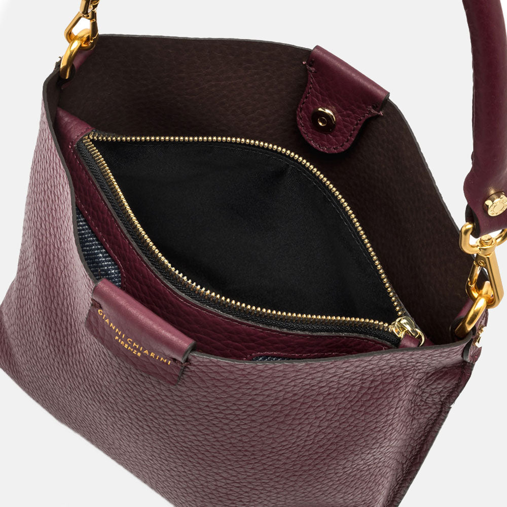 burgundy pebbled leather handbag with canvas lined internal compartment