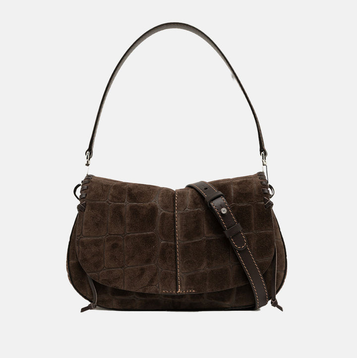 dark brown crocodile print suede saddle bag with top grab handle and leather crossbody strap